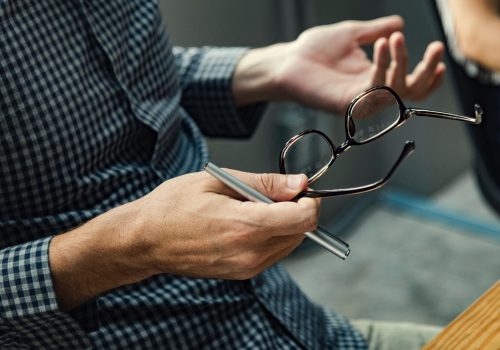rawpixel-800771-unsplash-small Man in checked shirt holding glasses, stock photo, BBMRI-ERIC
