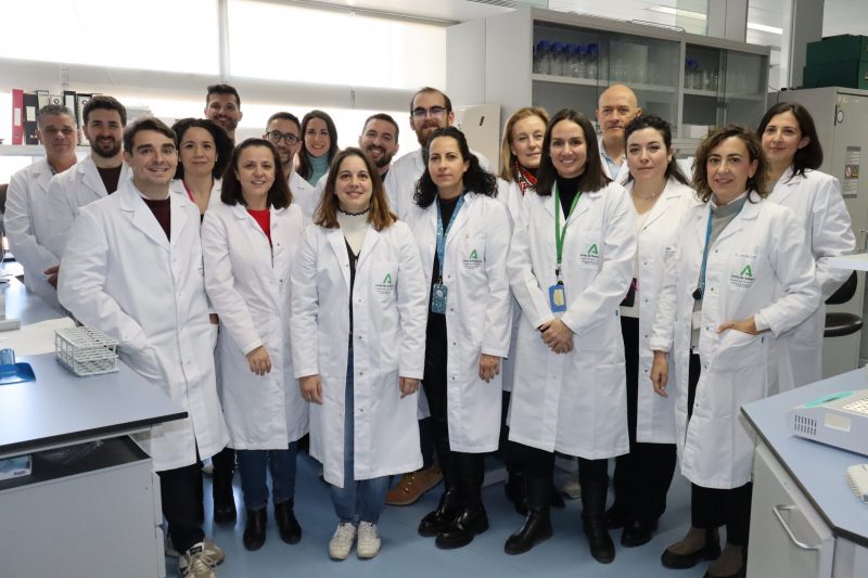 A picture showing the SSPA team. They are all wearing white medical gowns and looking at the camera.